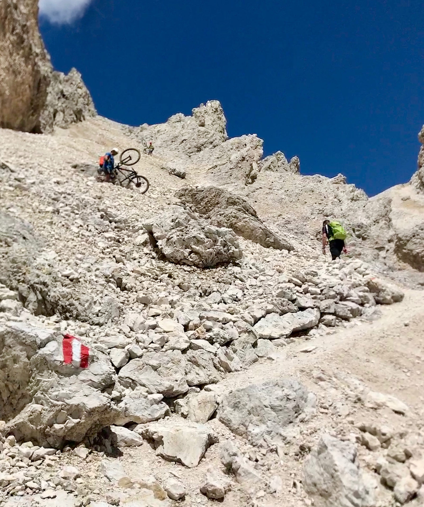 Carrying mountain bikes down the pass