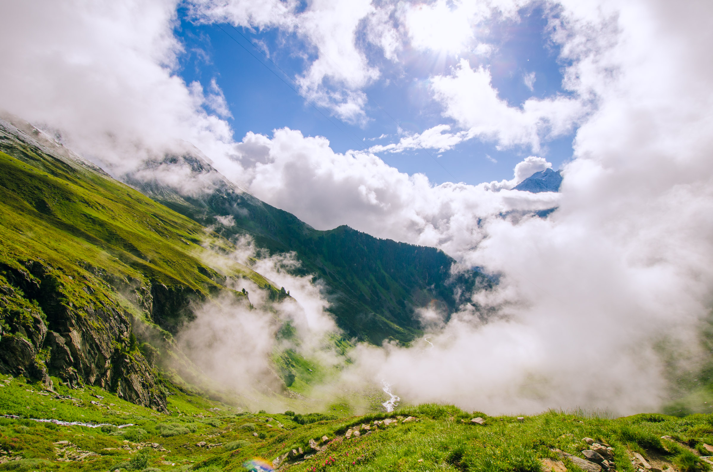 Rising clouds behind Falbesoner Alm