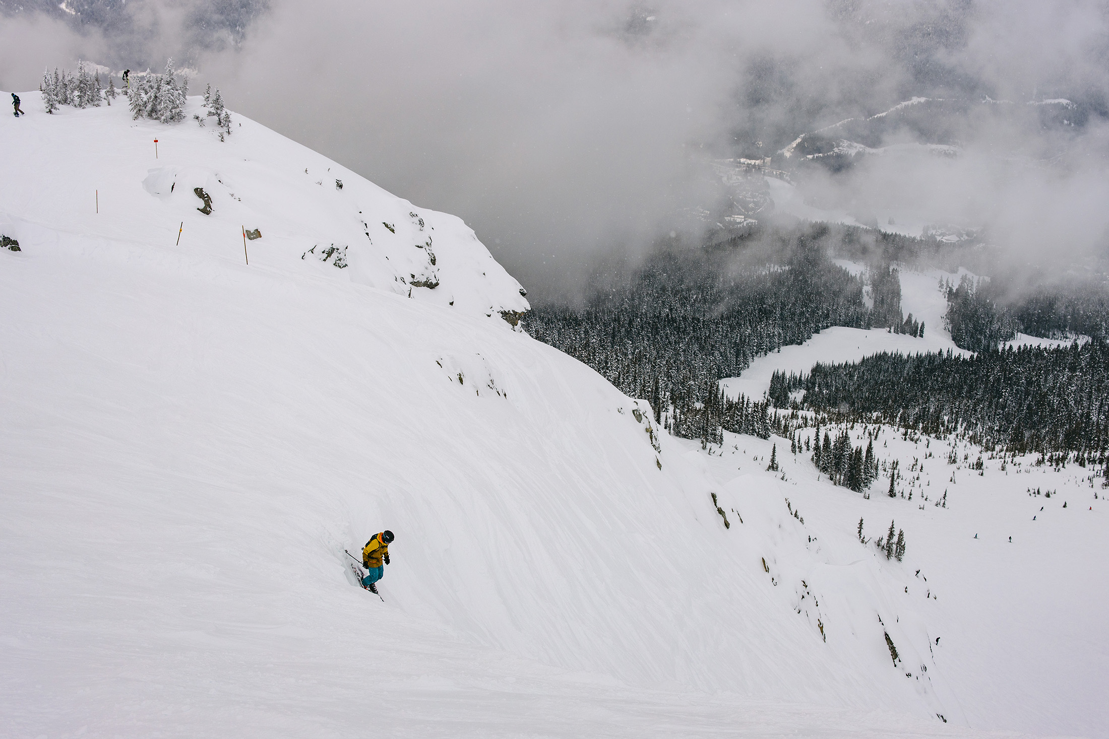 Skier dropping into Bagel Bowl, Whistler