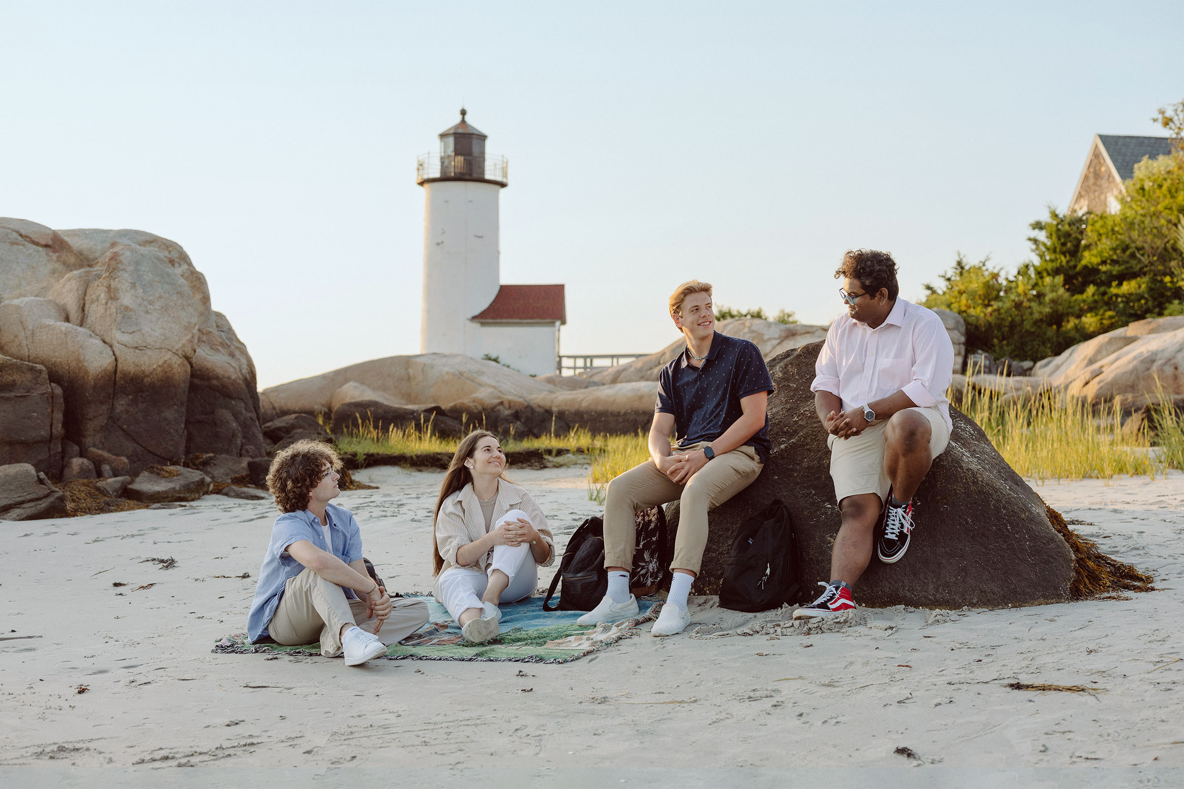 college students in front of lighthouse