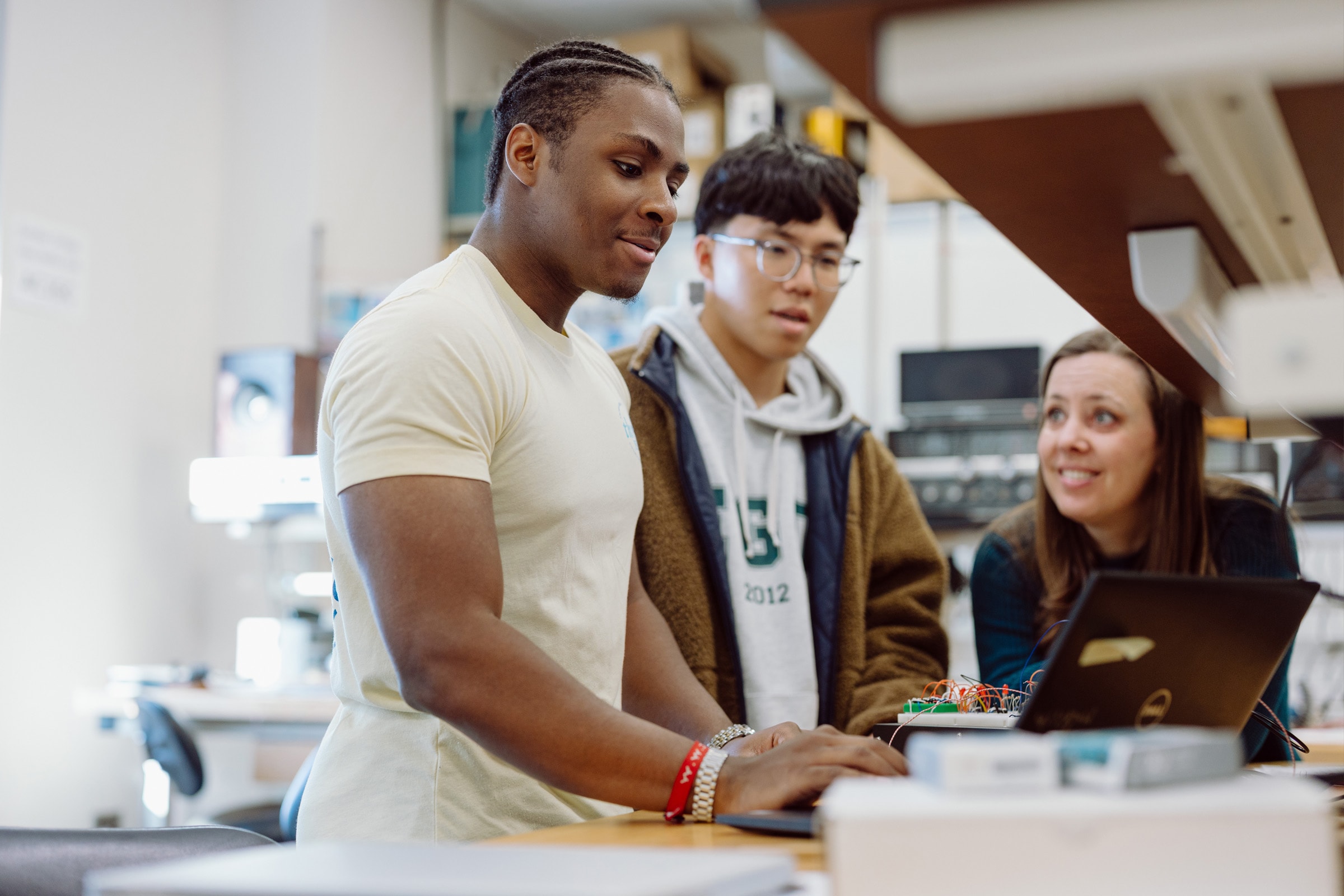 Students and professor in mechanical engineering lab