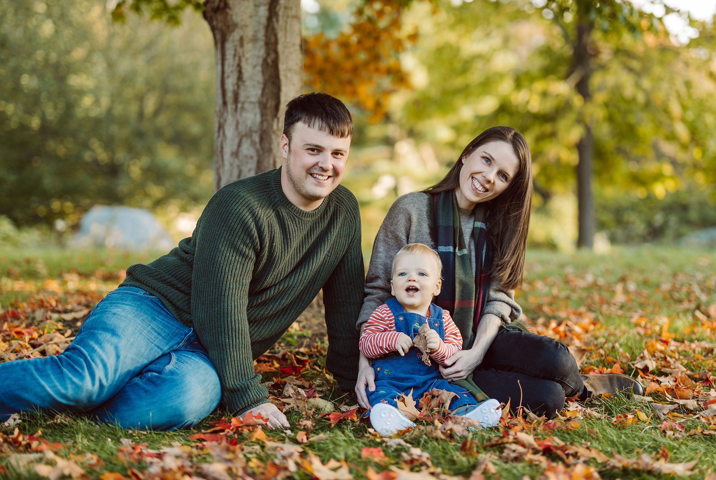 Family in fall leaves